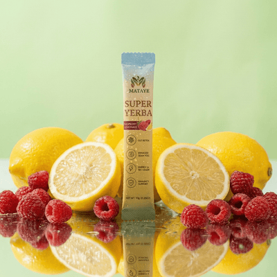 Mataya Super Yerba sachet with lemons and raspberries on a reflective surface