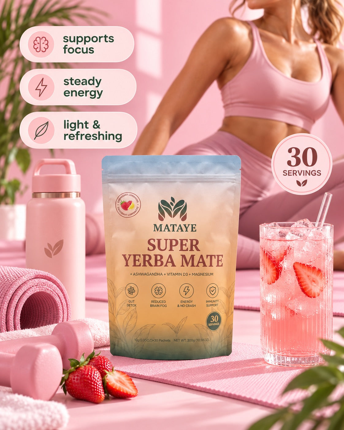 A stand-up pouch of MATAYE Super Yerba Mate placed on a pink yoga mat with a pink drink of strawberry-infused liquid, a pink bottle, and pink dumbbells. A woman in pink workout clothes is blurred in the background, along with callout bubbles about focus, energy, and refreshing taste, plus a 30 servings badge.